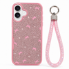 Pink glitter bow phone case with wrist strap installed on iPhone 17, rear camera view