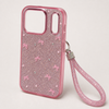 Angled view of pink glitter bow case for iPhone 17 Pro showing two-part camera opening